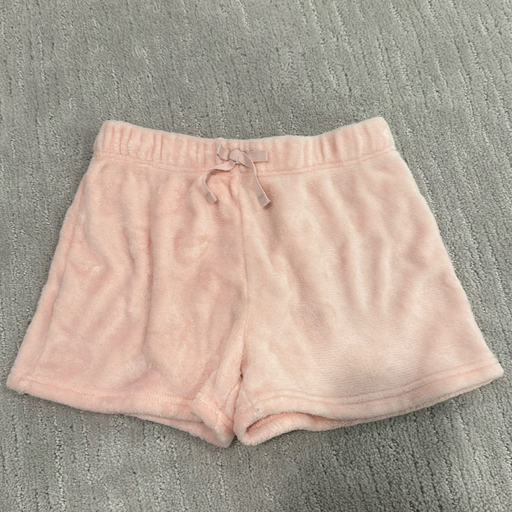 These are pink fluffy shorts for youth girls. The brand is BCBG.